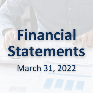 2022 Financial statements text over background of someone working on financial documents