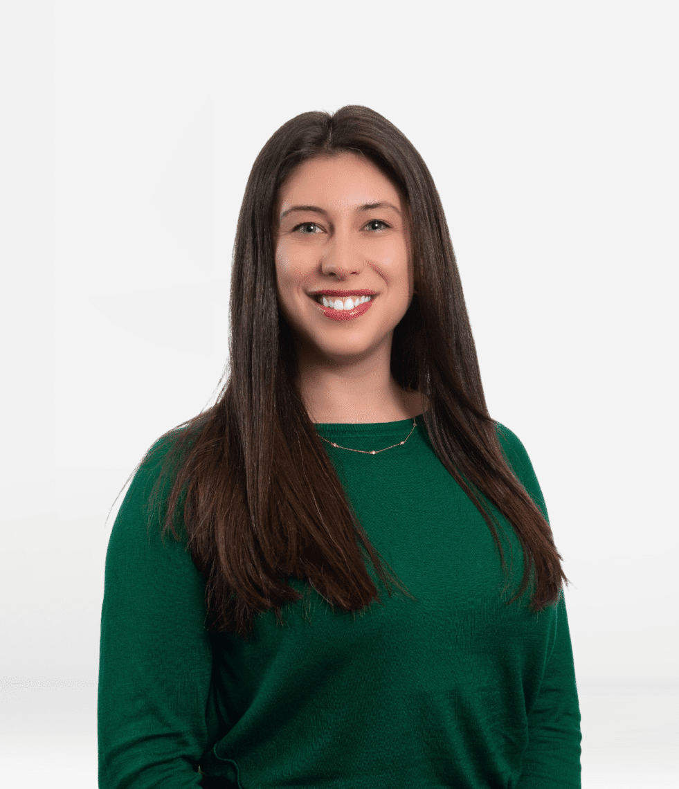 brown hair woman with green shirt on grey background