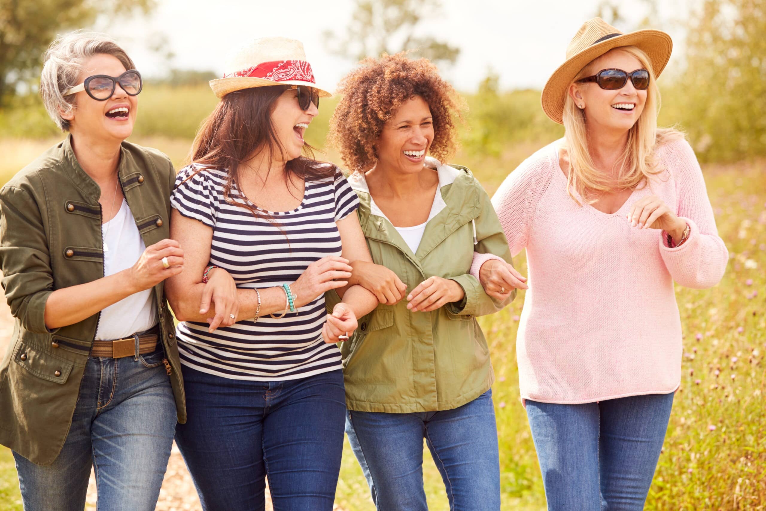 A group of women walking together outside.