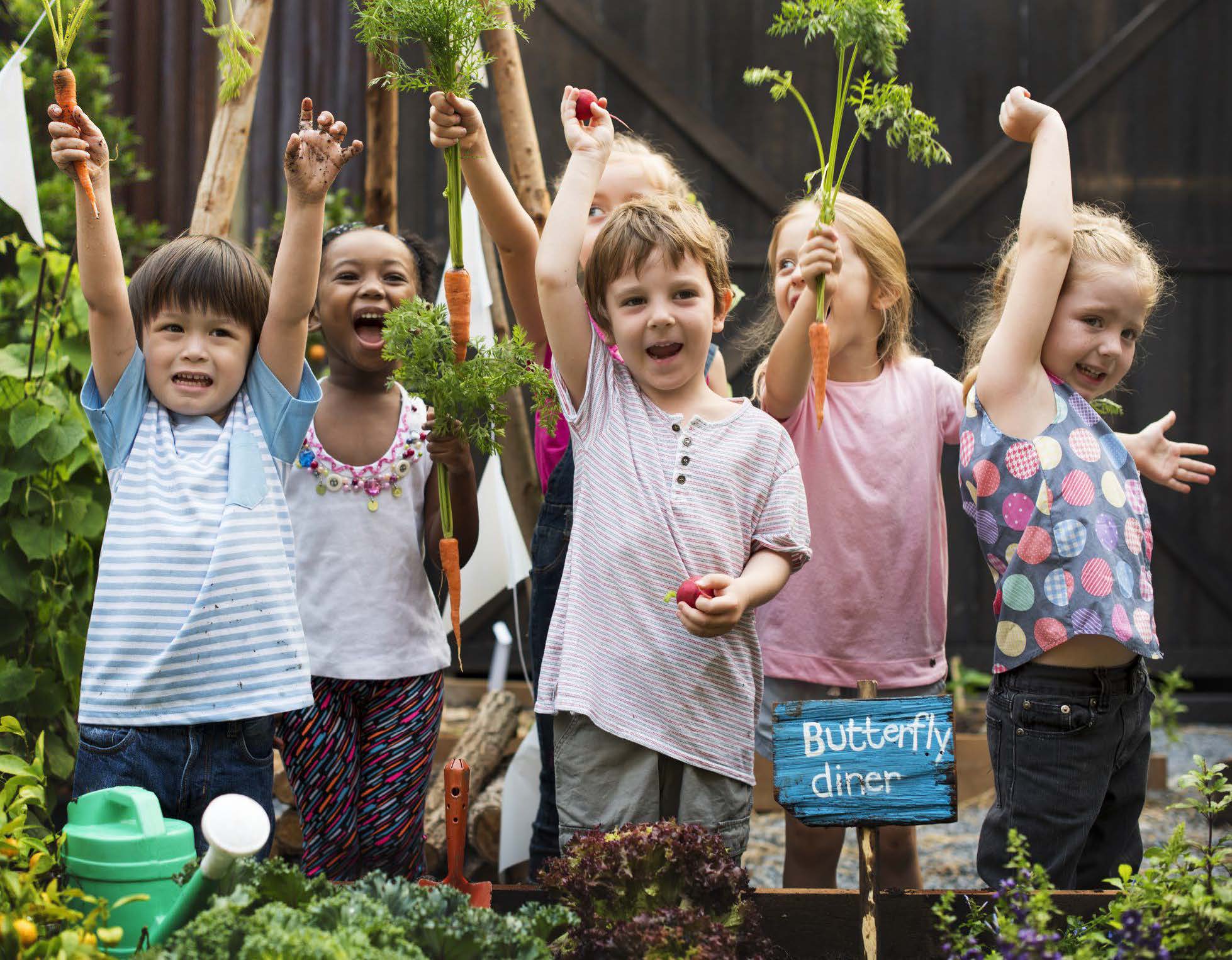 Children excited in a garden