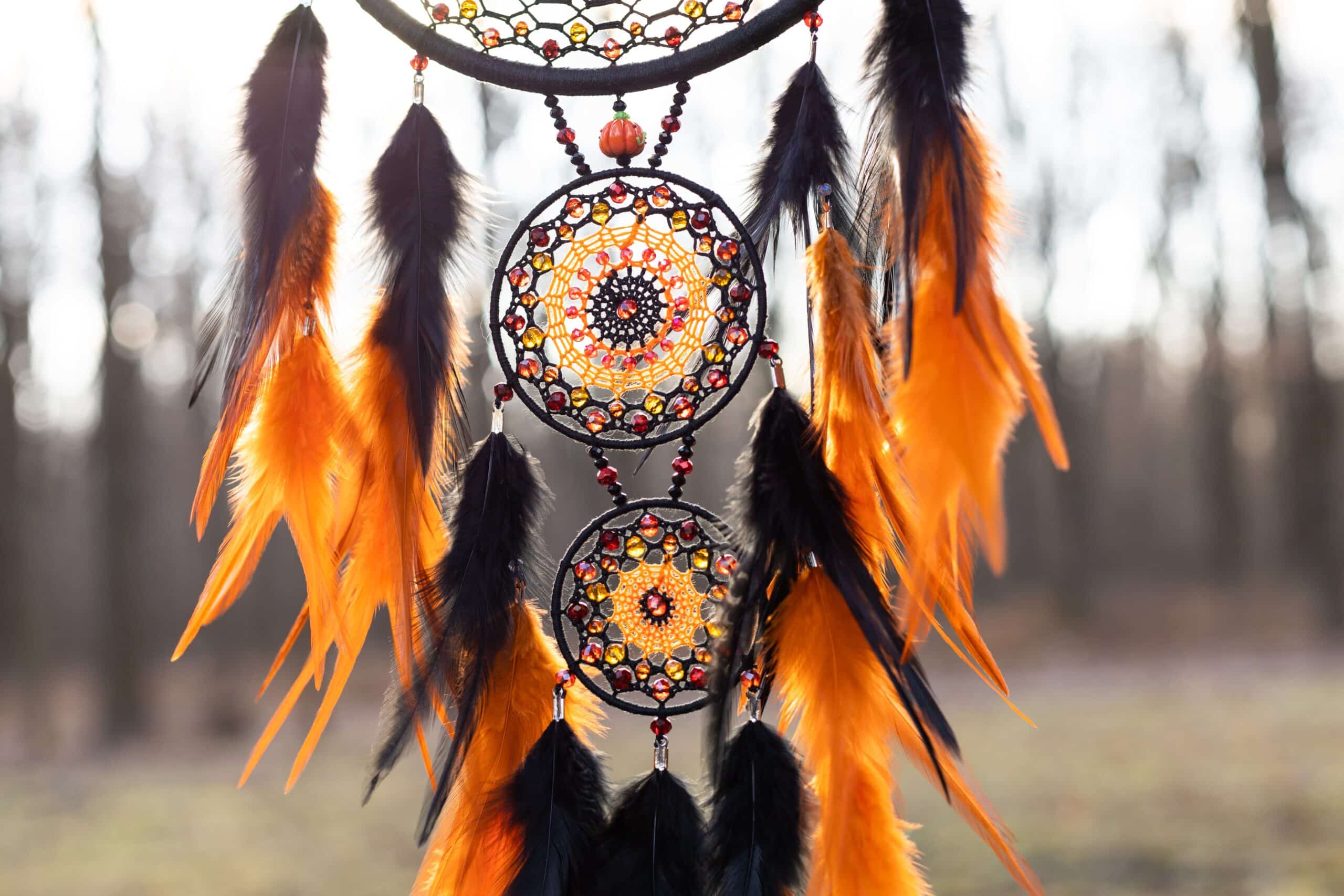Dream catcher with feathers threads and beads rope hanging.