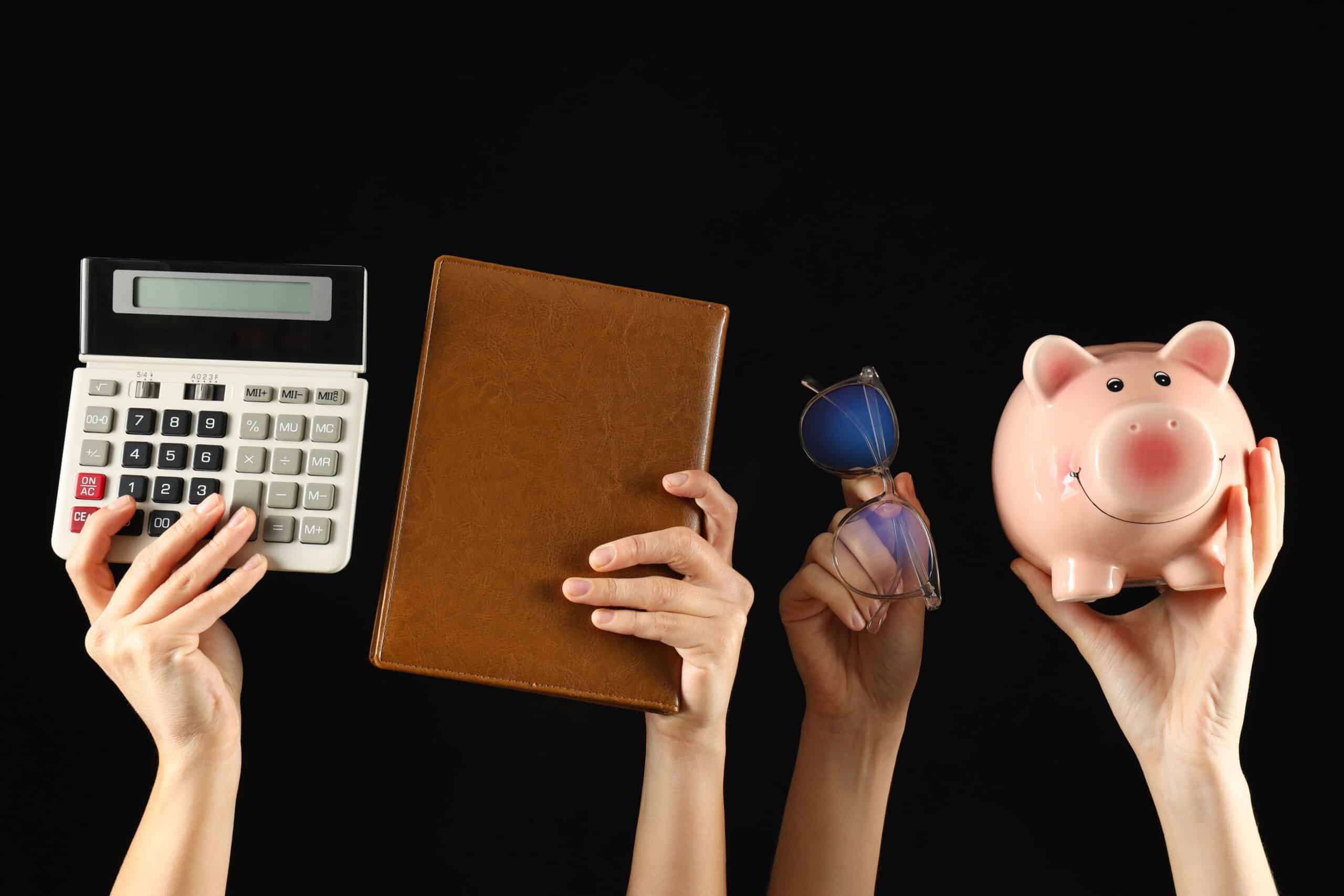 Symbols of accounting and financial calculations, in the hands of women.