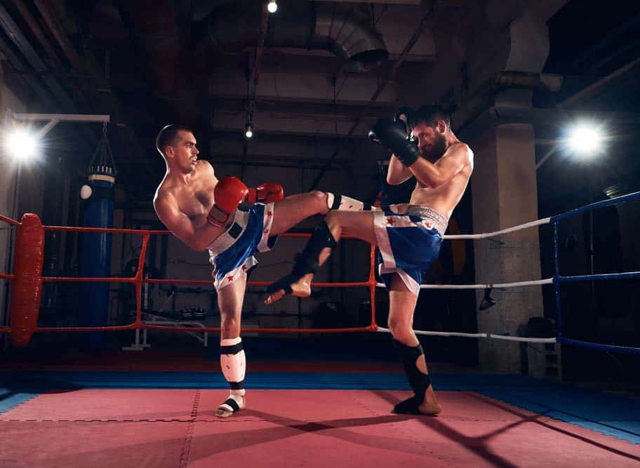 two kickboxers sparring.