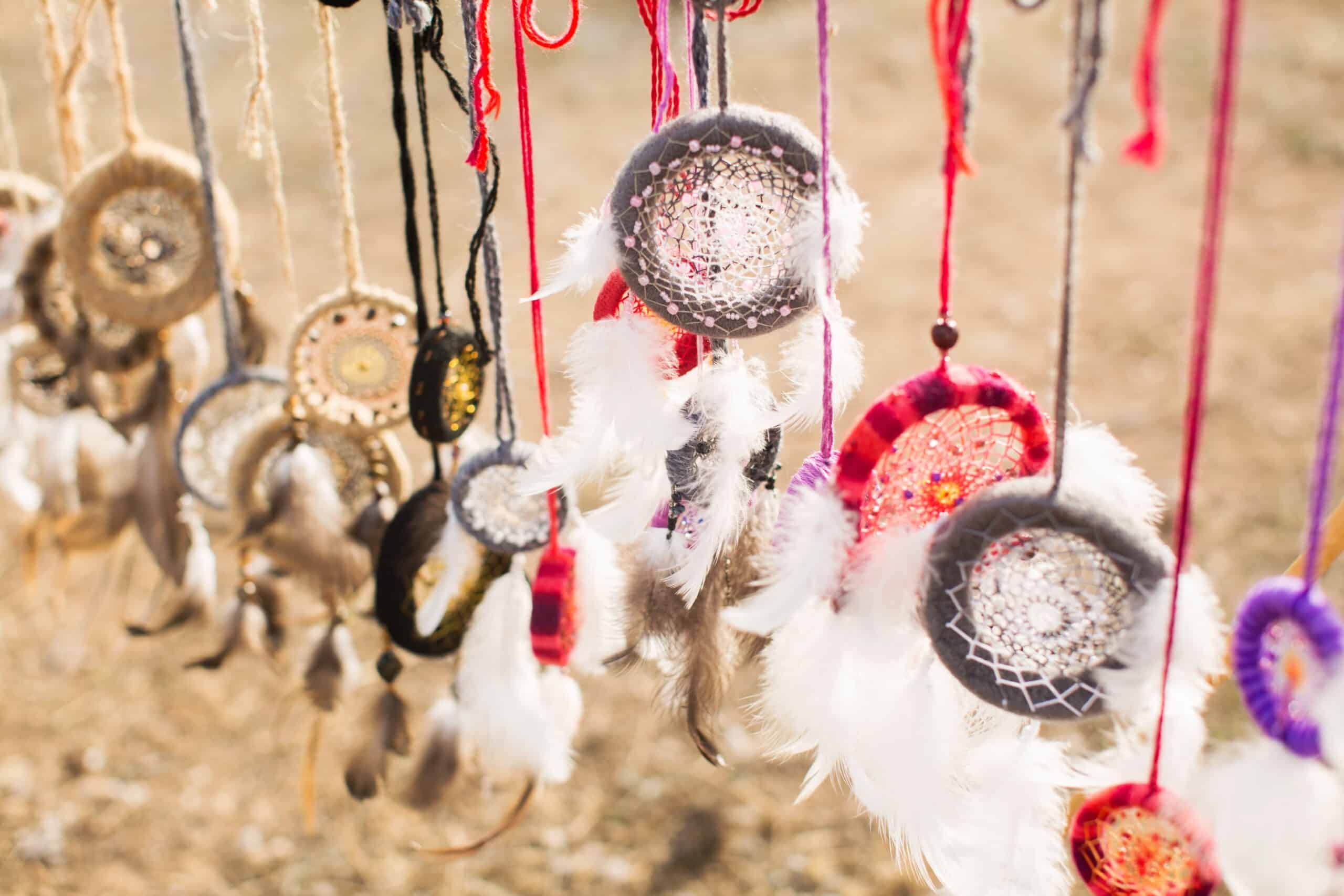 A collection of dream catchers hanging outdoors. Used to promote Children's Dream Catcher Workshop.