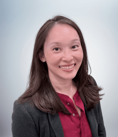 A portrait of Stephanie Chow on a light grey background.