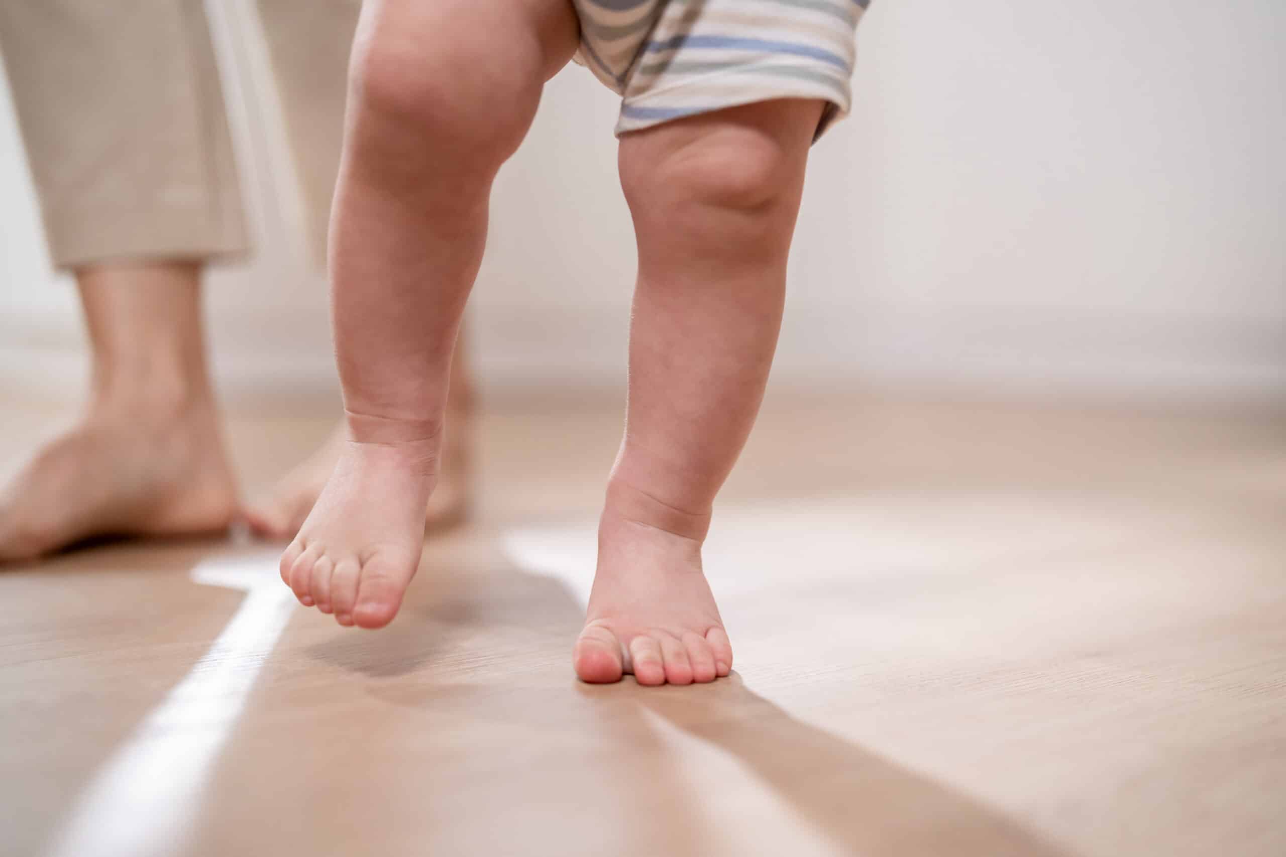 baby taking first steps