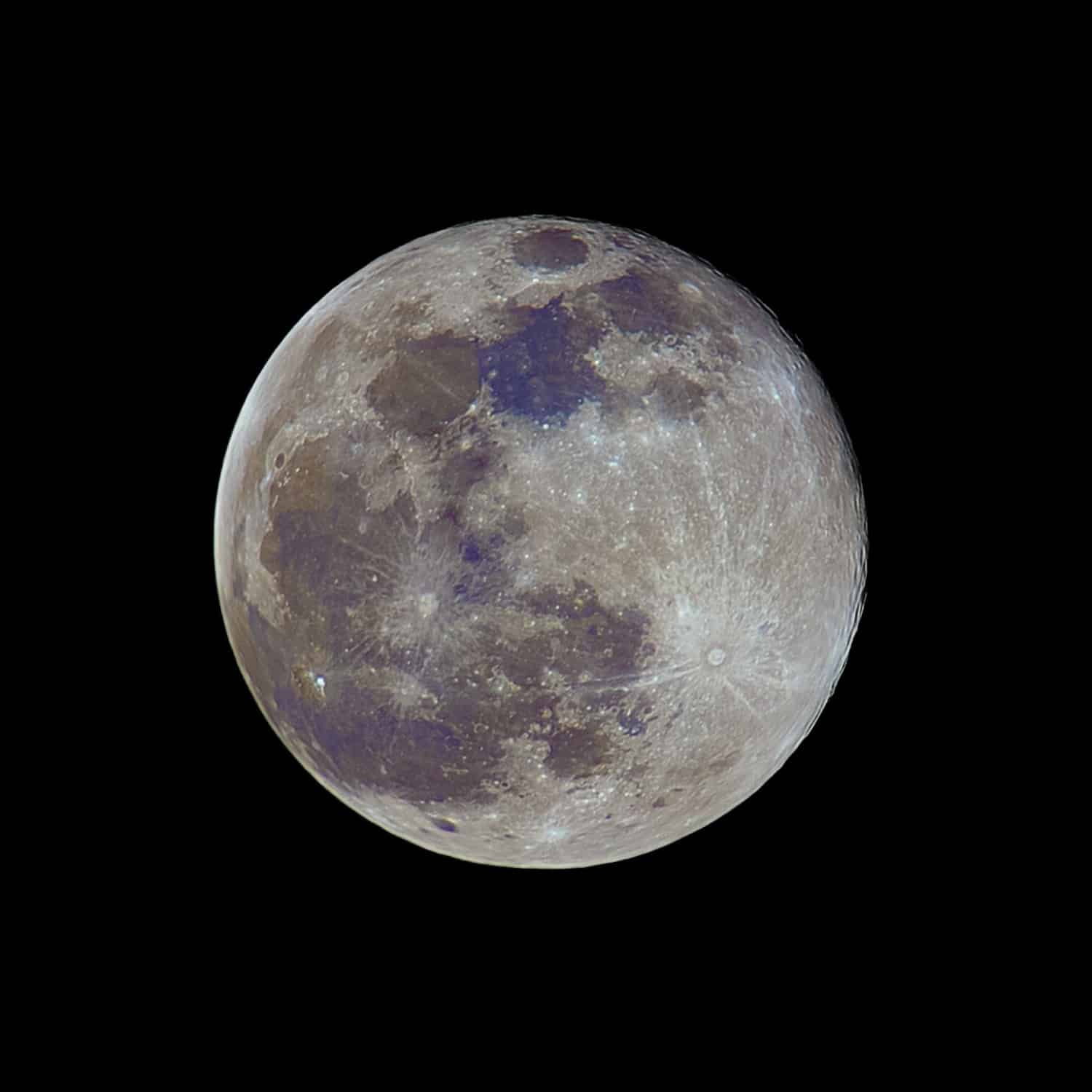 Full and colorful Moon on a dark sky above Zagreb, Croatia. Colors of the full Moon.