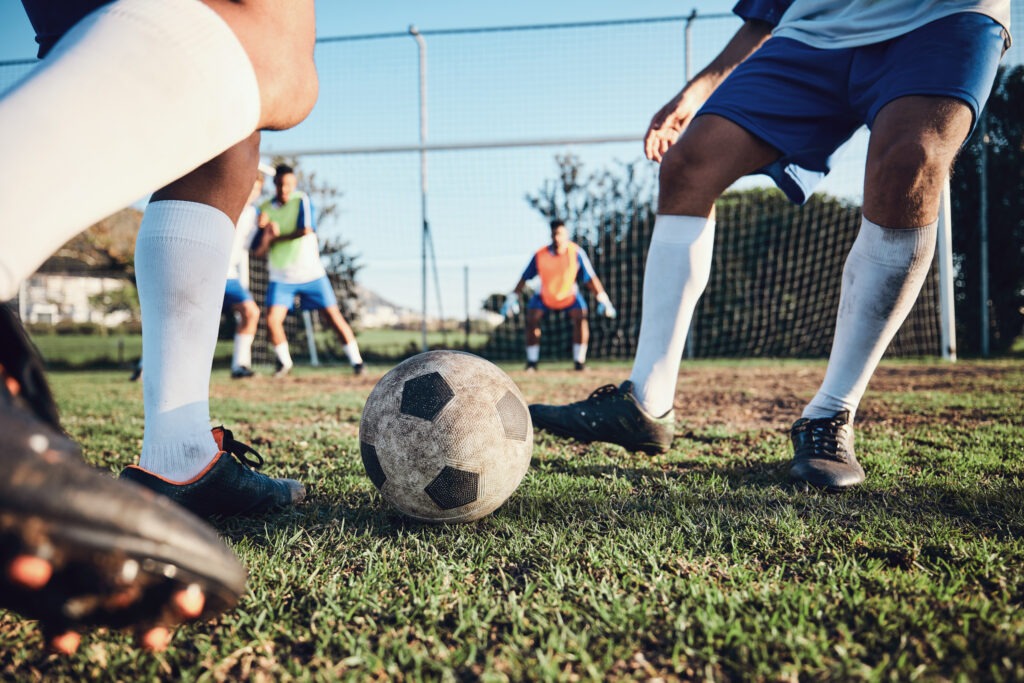 ootball, game and men with exercise, grass and health with workout goal, fitness and motion